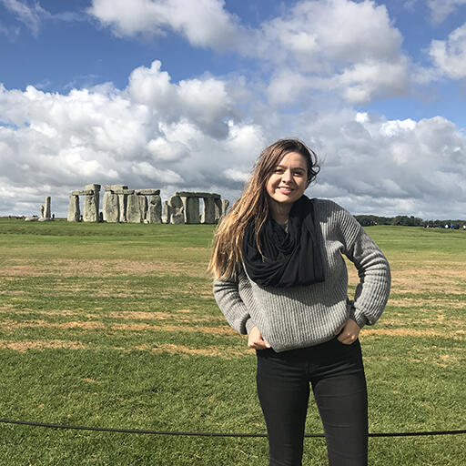 Student Ashley McQuade standing in front of Stonehenge